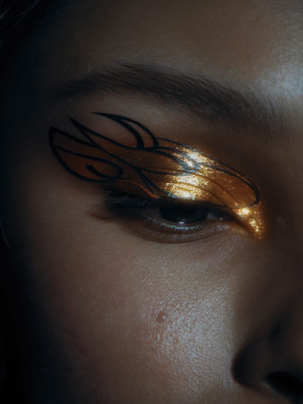 Metallic foil eye makeup close-up